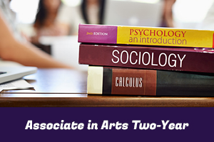 Associate in Arts Two-Year: photo of psychology, sociology, and calculus textbooks stacked on a desk