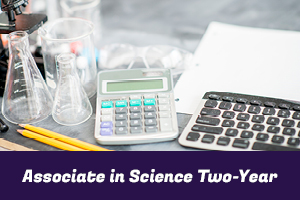 Associate in Science Two-Year: photo of a microscope, beakers, calculator and keyboard sitting on a desk