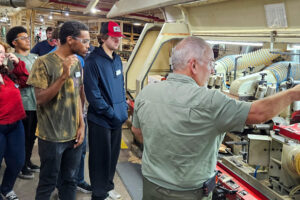 SEED Program: Students observing equipment and processes during the Stephenson Millwork tour.